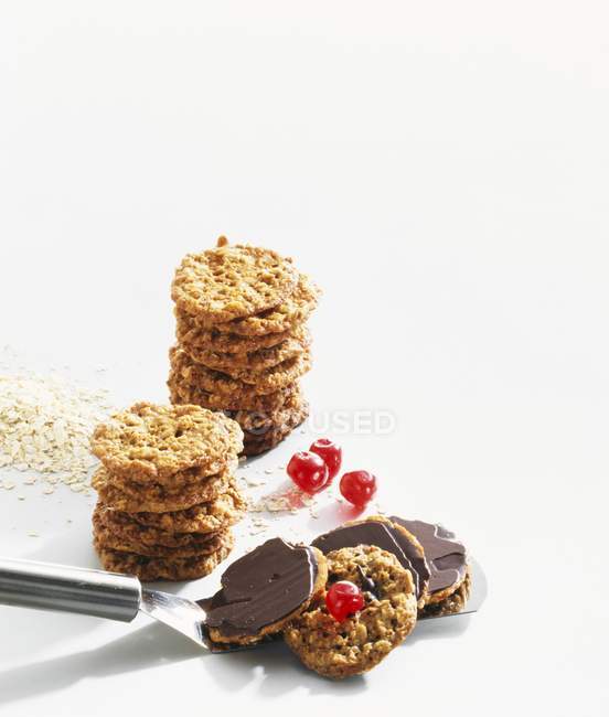 Oat biscuits with chocolate — Stock Photo