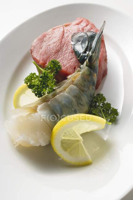 Beef fillet and king prawn — Stock Photo