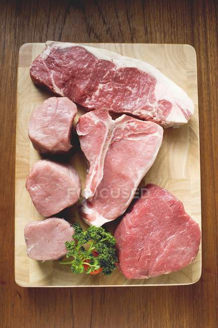 Beef steaks and pork fillets — Stock Photo