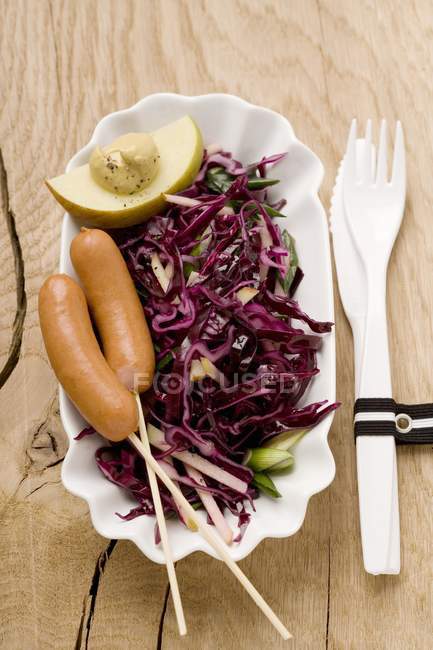 Red cabbage salad with sausages — Stock Photo