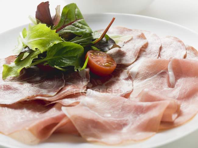 Raw ham and salami — Stock Photo