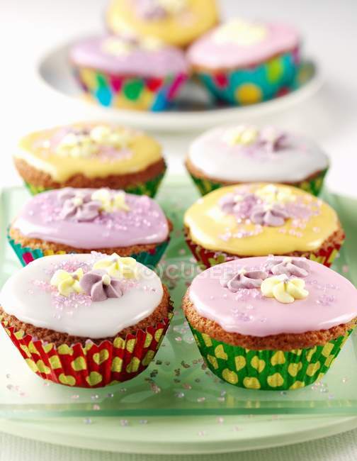 Fairy cakes in rows — Stock Photo