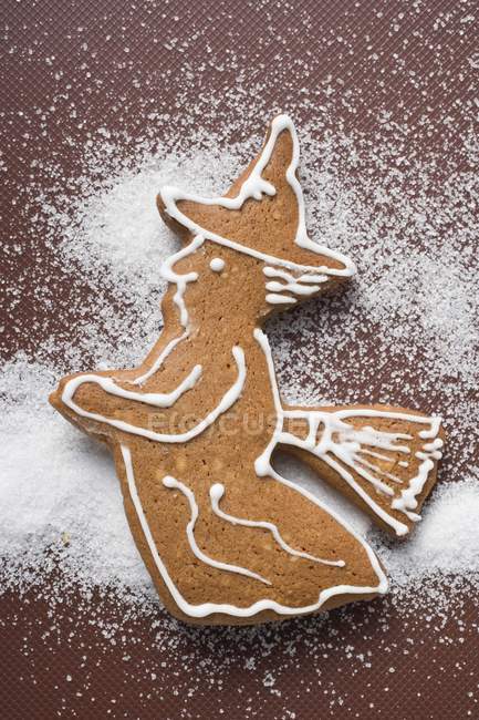 Gingerbread witch on brown — Stock Photo