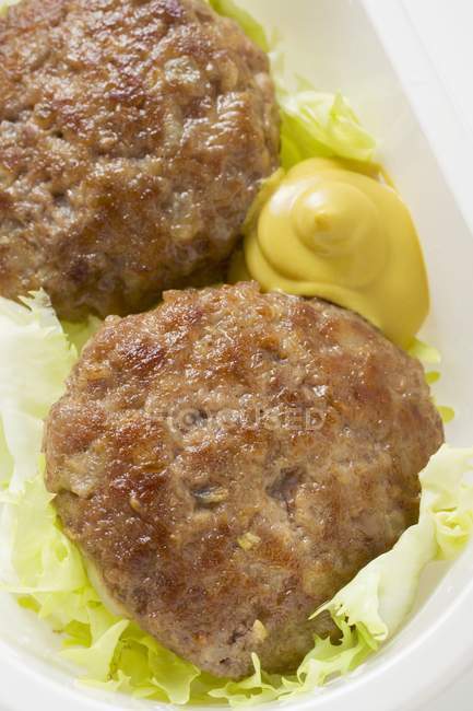Beef Burgers with mustard — Stock Photo