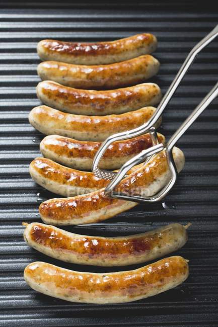 Several grilled sausages — Stock Photo