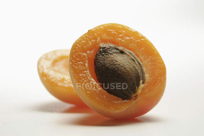 Halved apricot with stone — Stock Photo
