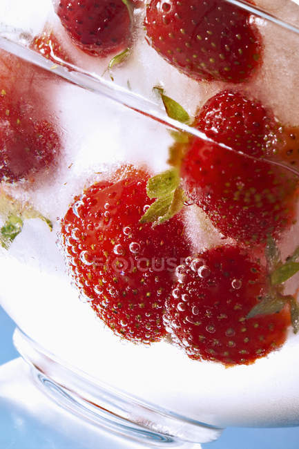 Frozen strawberries in glass — Stock Photo