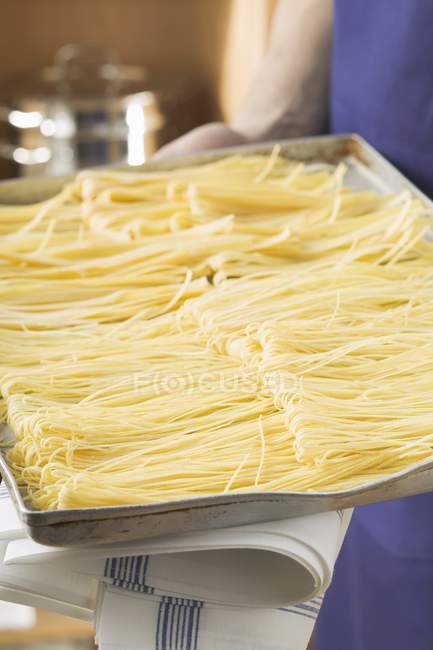 Homemade pasta on baking tray — Stock Photo