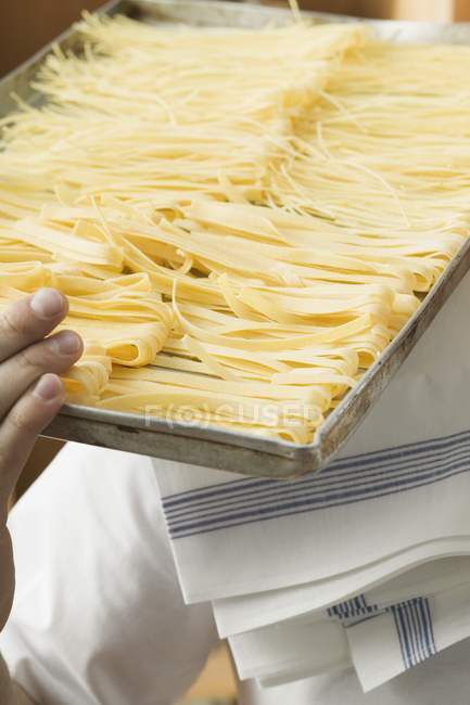 Homemade pasta on baking tray — Stock Photo