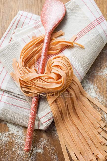 Homemade orange ribbon pasta — Stock Photo