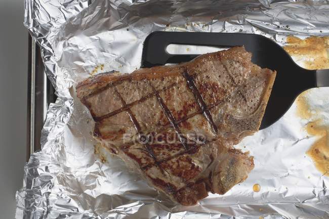 Grilled T-bone steak — Stock Photo