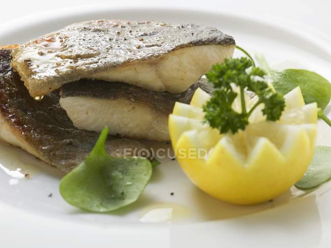 Fried trout fish with lemon — Stock Photo