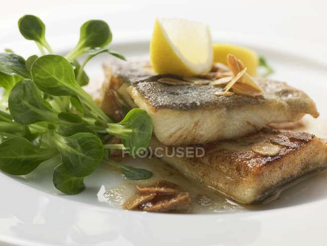 Fried trout with flaked almonds — Stock Photo