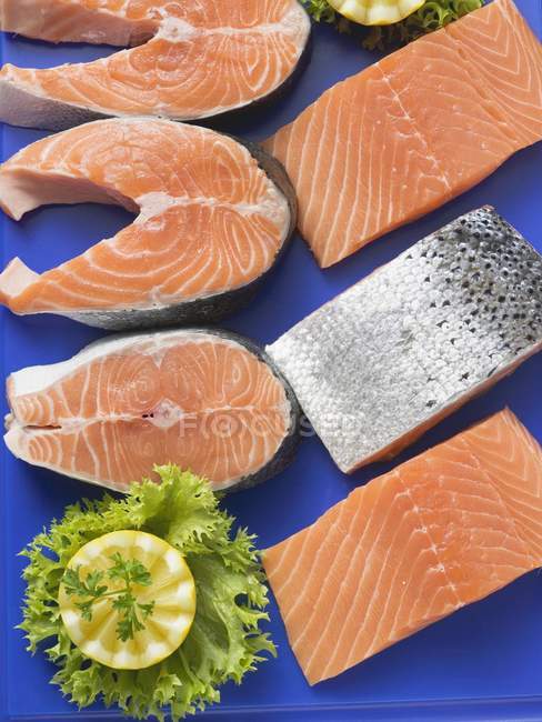 Fresh salmon fillets and salmon cutlets — Stock Photo