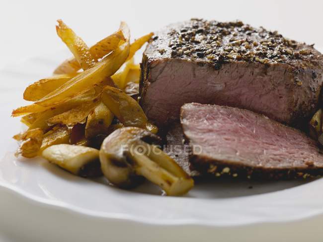Peppered steak with chips — Stock Photo