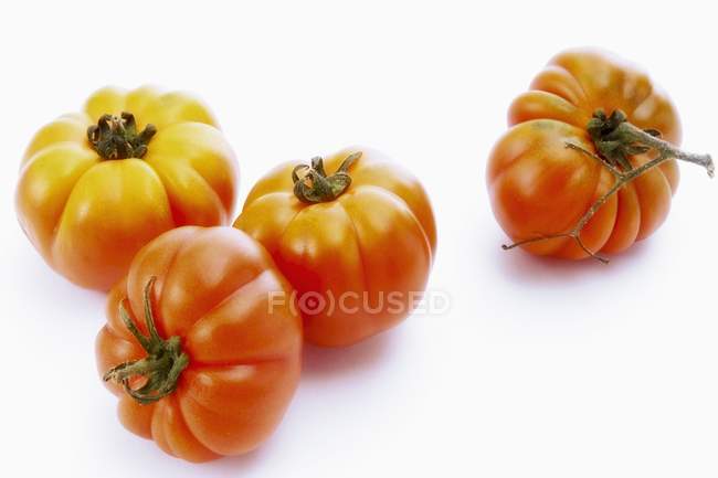 Четыре помидора из говядины — стоковое фото