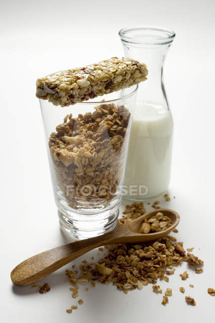 Crunchy muesli in glass and on spoon — Stock Photo