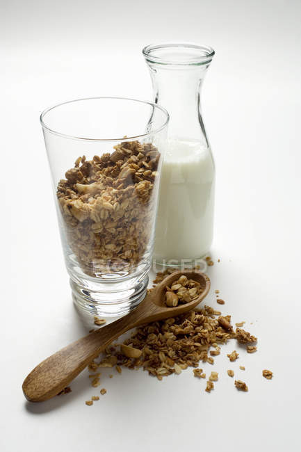 Crunchy muesli in glass and on spoon — Stock Photo