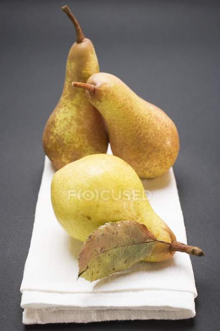Three pears on cloth — Stock Photo