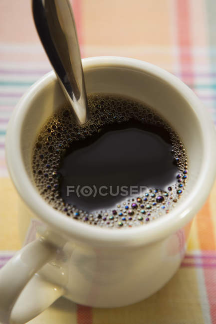 Mug of black coffee — Stock Photo