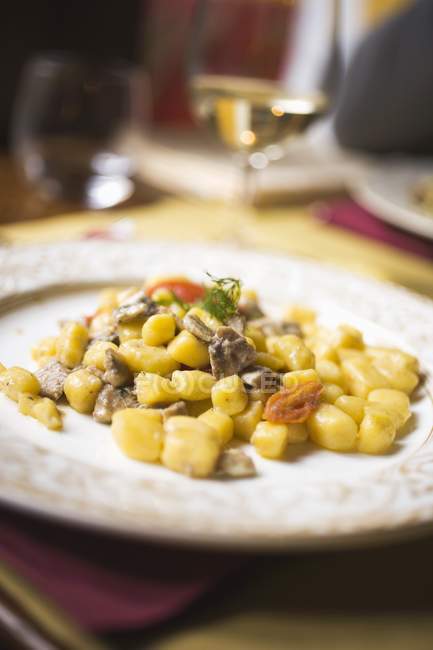 Potato gnocchi with anchovies — Stock Photo