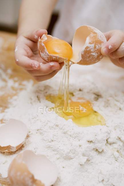 Child making pasta dough — Stock Photo