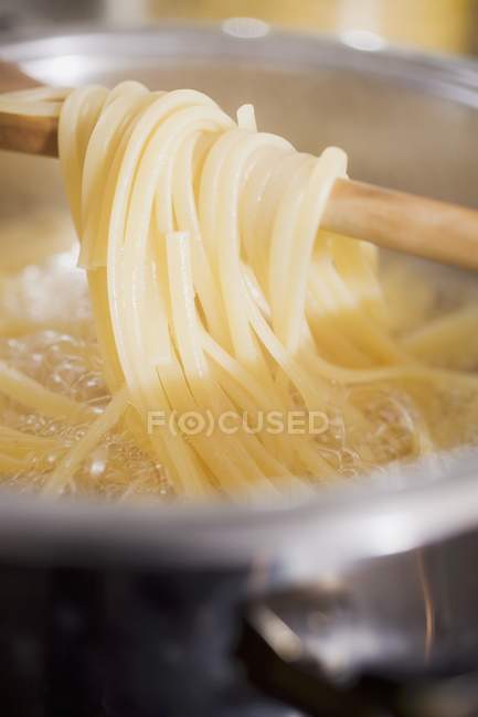 Cooked ribbon pasta on spoon — Stock Photo