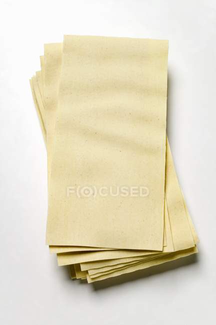 Bunch of raw Sheets of lasagne — Stock Photo