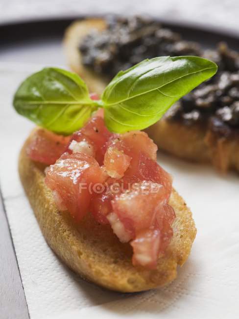 Bruschetta with tomato and basil — Stock Photo