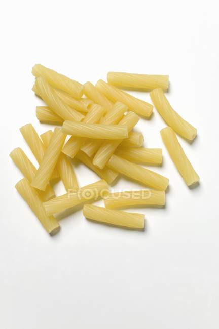Raw dried rigatoni pasta — Stock Photo