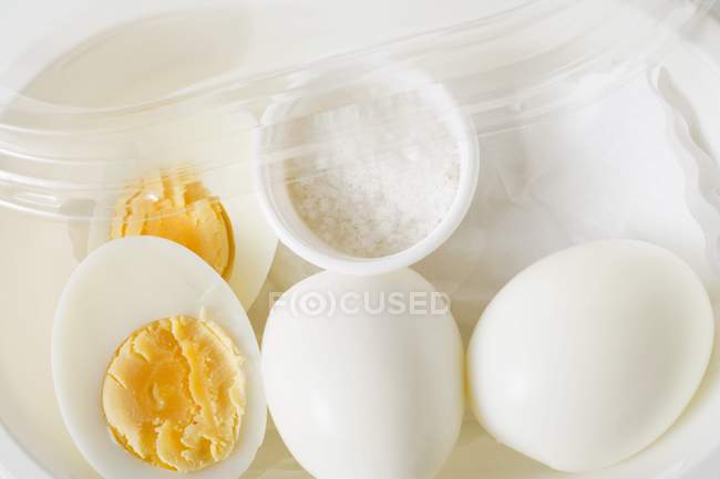 Boiled eggs and salt — Stock Photo