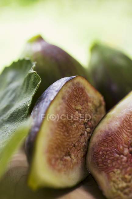 Several half and whole figs — Stock Photo