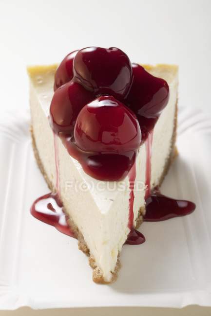 Cheesecake with cherry sauce — Stock Photo