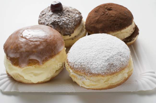 Quatro donuts diferentes — Fotografia de Stock
