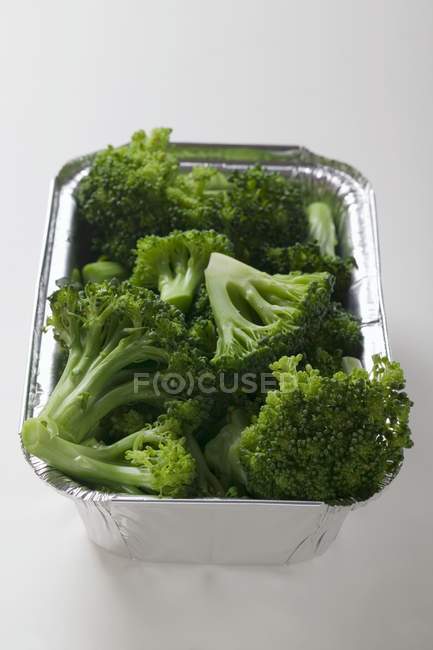 Steamed broccoli in aluminium container — Stock Photo