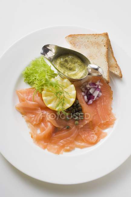 Smoked salmon with capers — Stock Photo