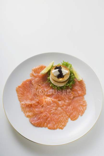 Smoked salmon with toasts — Stock Photo