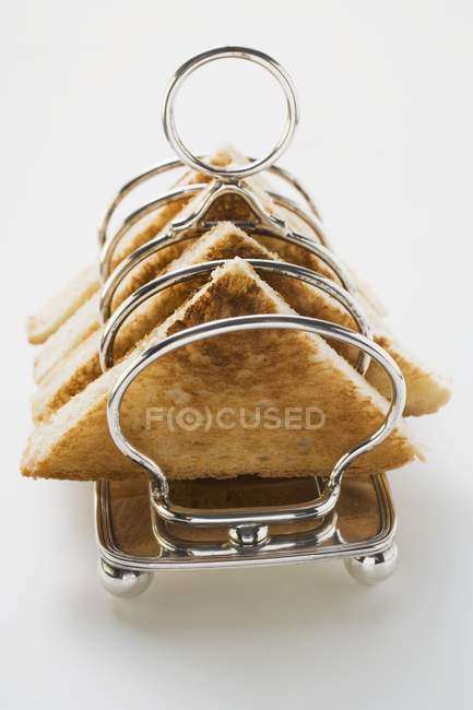 Closeup view of triangle toasts in toast rack — Stock Photo