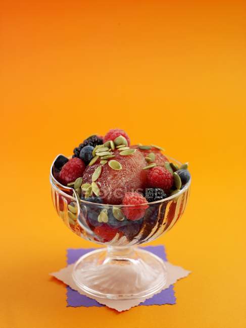 Closeup view of Sundae with fresh berries and seeds — Stock Photo