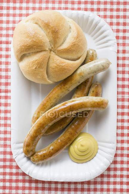 Sausages with mustard and bread roll — Stock Photo