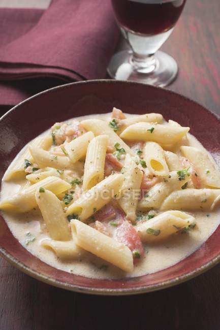 Penne pasta with salmon and sauce — Stock Photo