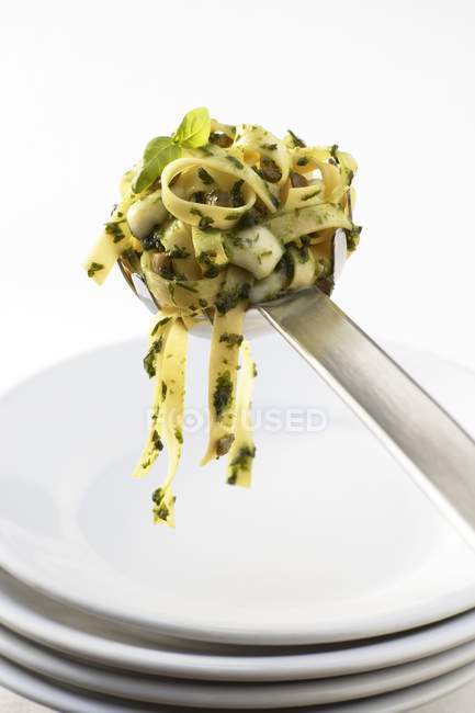 Tagliatelle ribbon pasta with pesto — Stock Photo