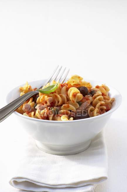 Fusilli puttanesca pasta with tuna — Stock Photo