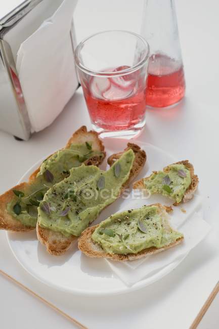 Bruschetta with avocado spread — Stock Photo