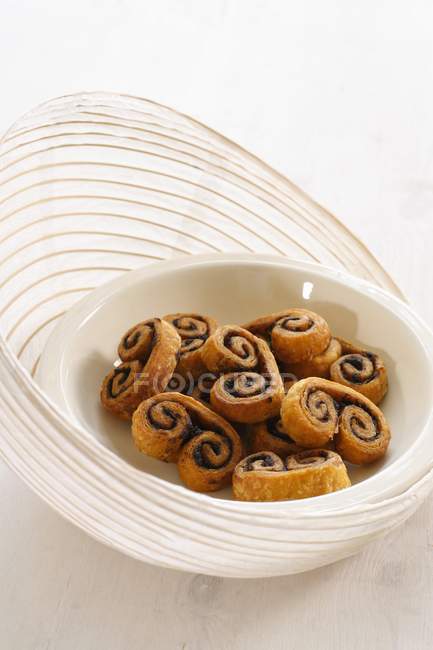 Elevated view of puff pastries with Tapenade in bowls — Stock Photo
