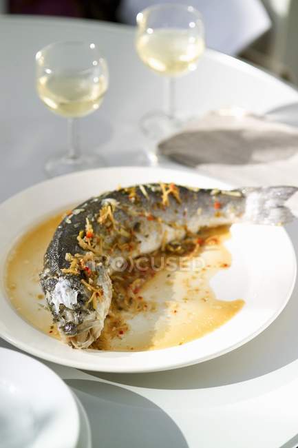 Roasted sea bass with shredded vegetables — Stock Photo