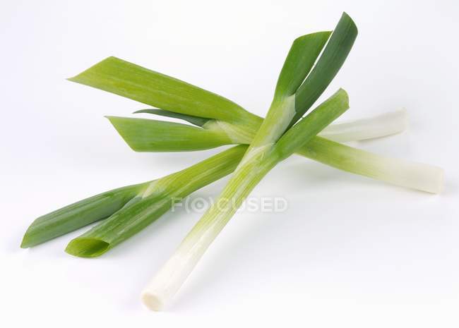 Three spring onions — Stock Photo