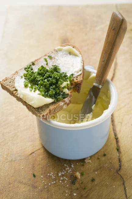 Bread and chives on  pot — Stock Photo