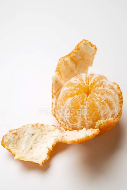 Partly peeled clementine — Stock Photo
