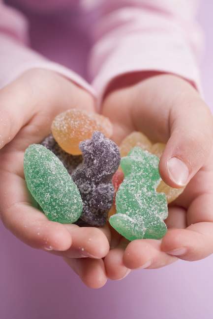 Hands holding sweets — Stock Photo